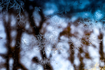 February frosty patterns on the windows of the car. Iced Glass