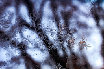 February frosty patterns on the windows of the car. Iced Glass