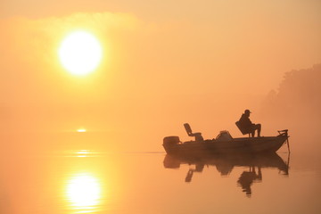 Fototapeta na wymiar Fishing at Dawn