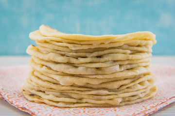 Stack of Fresh Floud Tortillas on Orange Cloth