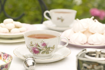 Coffee cup with breakfast on white table outdoors