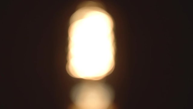 Old Incandescent Light Coming In Focus (Slow Motion)
