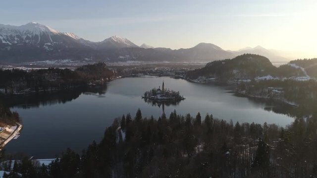 Aerial view of the church of the Assumption of Mary in the middle of Lake Bled.
