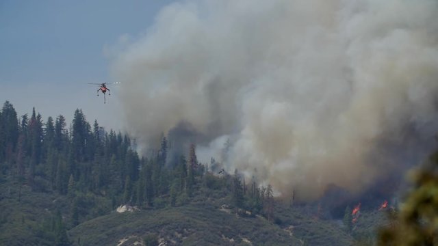 Erickson Air Crane Drops Retardant on Forest Fire