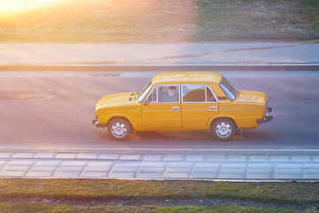 Old Soviet car in sunset rays