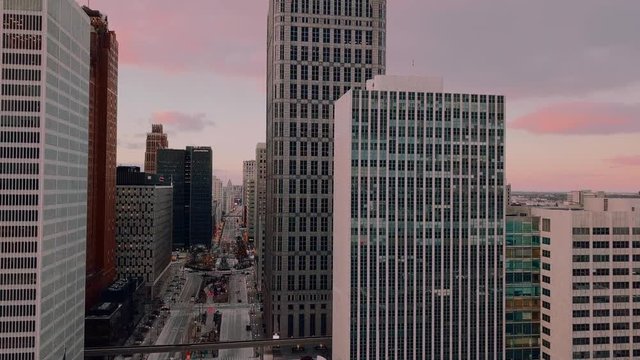 Sweeping drone shot of downtown office buildings.