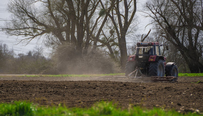 A farm tractor doing his job