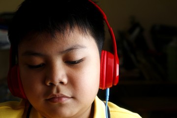 Young Asian boy with headphones