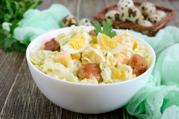 Light spring dietary salad from Chinese cabbage, chicken, cheese, quail eggs. Proper nutrition.