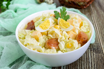 Light spring dietary salad from Chinese cabbage, chicken, cheese, quail eggs. Proper nutrition.