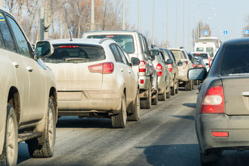 Cars standing in a traffic jam on city street