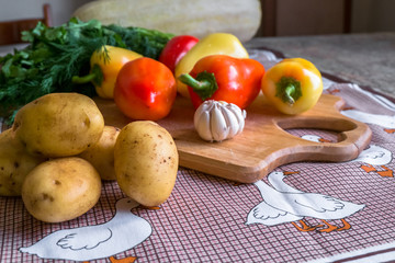 Kitchen still life. Fresh raw vegetables on the table.