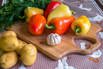 Kitchen still life. Fresh raw vegetables on the table.