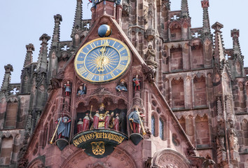 Clock of Nuremberg Cathedral church - landmark in Germany, Hauptmarkt square