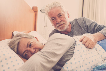 senior couple in the bed