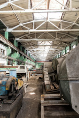 Fototapeta premium Industrial landscape. Destroyed building. The abandoned shop of the metallurgical plant