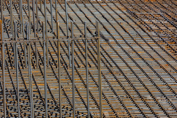 Fragment of the frame from the reinforcement, for pouring the formwork of the future building.