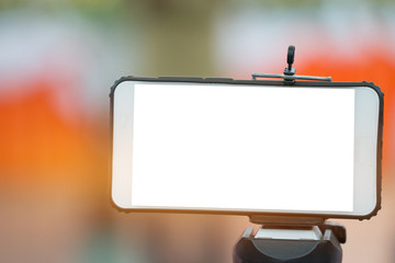 LCD Screen Blank smartphone on Tripod for copy space in your text message or promotional content, advertising mock up empty insert for coutomer Background.