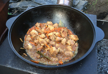 Preparation of pilaf in kazan