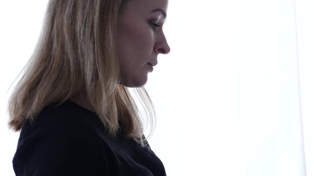 pensive female student makes notes in a notebook or diary. 4K