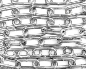 Rows of metal chain on white as abstract background. Top view.