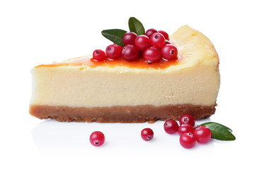 Close-up slice of delicious homemade cheesecake with fresh cranberries and caramel sauce