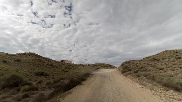 driving on off road tracks in the puntas de calnegre natural park on the coast in murcia, spain