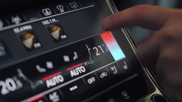 Vehicle, modern car, sensory dashboard, man regulates climate control in car control panel, touchscreen.

