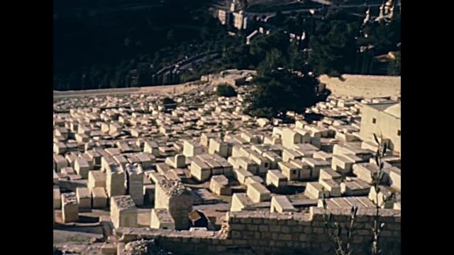 Aerial view panorama of the ancient Jewish cemetery from Olive mountain. Old Jerusalem city on 80s, Israel. Historic restored footage on 1980s.