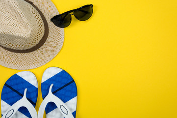 Top view of beach summer accessories with copy space. Traveler accessories. Summer background. Summer beach vacation concept. Flat lay, top view.
