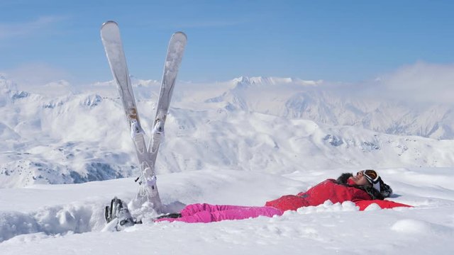 Skier Throw Up Snow In The Air, Raises Her Leg And Falls In The Snow
