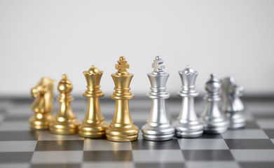 chess battle about Gold and Blond on chess board.