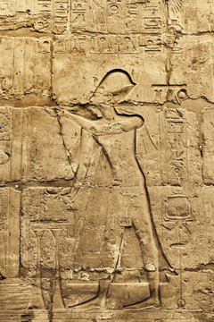 Ancient wall with egyptian hieroglyphs in the Karnak Temple