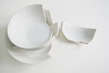 Large round bowl broken pieces on white background.