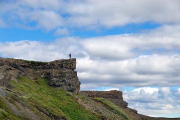 Fototapeta na wymiar Iceland. Photographer taking a waterfall