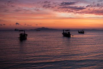 Boat on ocean sunrise 