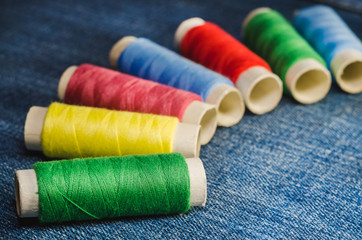 Spools of multi-colored threads, arranged in a semicircle