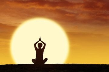 Silhouette woman doing yoga and meditation