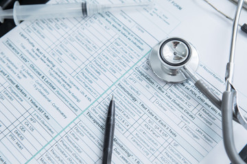 Patient medical form with pen