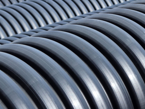 The warehouse of industrial plastic pipes and large diameter hoses. Products from plastic. Drainage and sewerage. Modern technologies of building houses and ennobling the territory. Urban network.