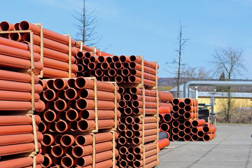 The warehouse of industrial plastic pipes and large diameter hoses. Products from plastic. Drainage...