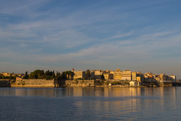 old town of corfu in morning sun viewed from sea, blue sky