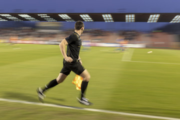 Assistant of fotball referee - intentional blurred
