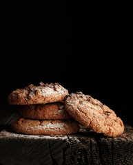 Oats cookies over black background
