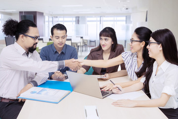 African businessman with colleagues in the office