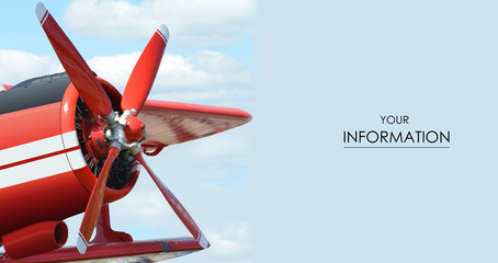 Red plane with propeller flying in blue skies