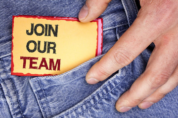 Word writing text Join Our Team. Business concept for Get over unemployment joining better career workforce written on Sticky Note Paper holding by man on the Jeans background.