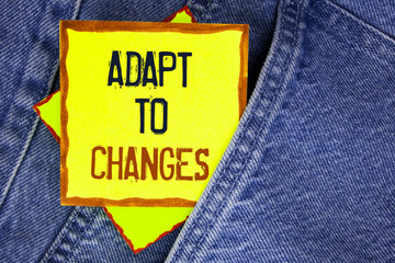 Conceptual hand writing showing Adapt To Changes. Business photo showcasing Innovative changes adaption with technological evolution written on Yellow Sticky Note Paper on the Jeans background.