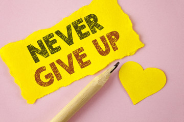 Writing note showing  Never Give Up. Business photo showcasing Be persistent motivate yourself...