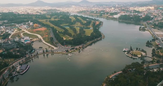 AERIAL 4K: Aerial view from the drone to Dalat city and Cam Ly Spring lake.Southern parts of the Central Highlands region of Vietnam
